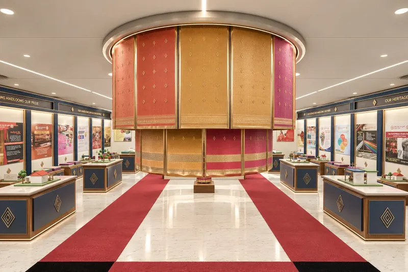 Alternate concept: a suspended ring of woven textiles over the central red-carpet route.